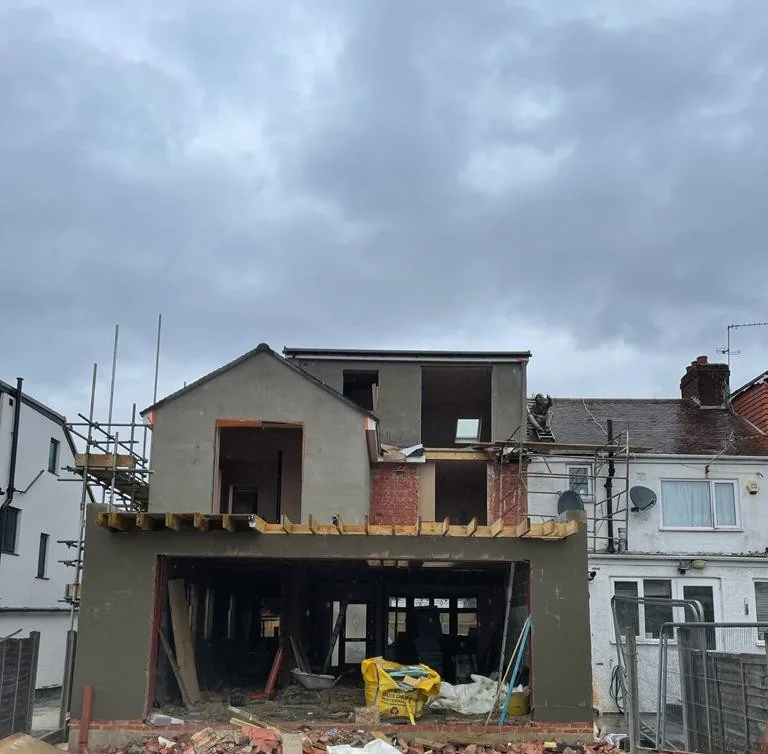Before: the same extension mid-build, with an open shell and no glazing yet