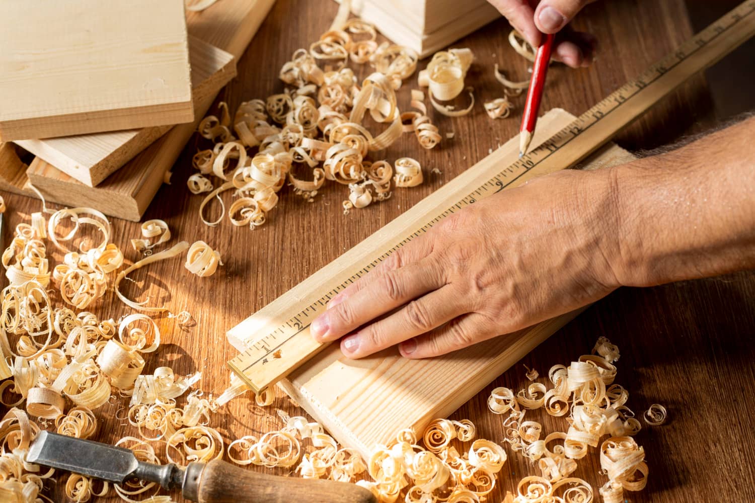 carpenter-working-piece-wood-with-pencil